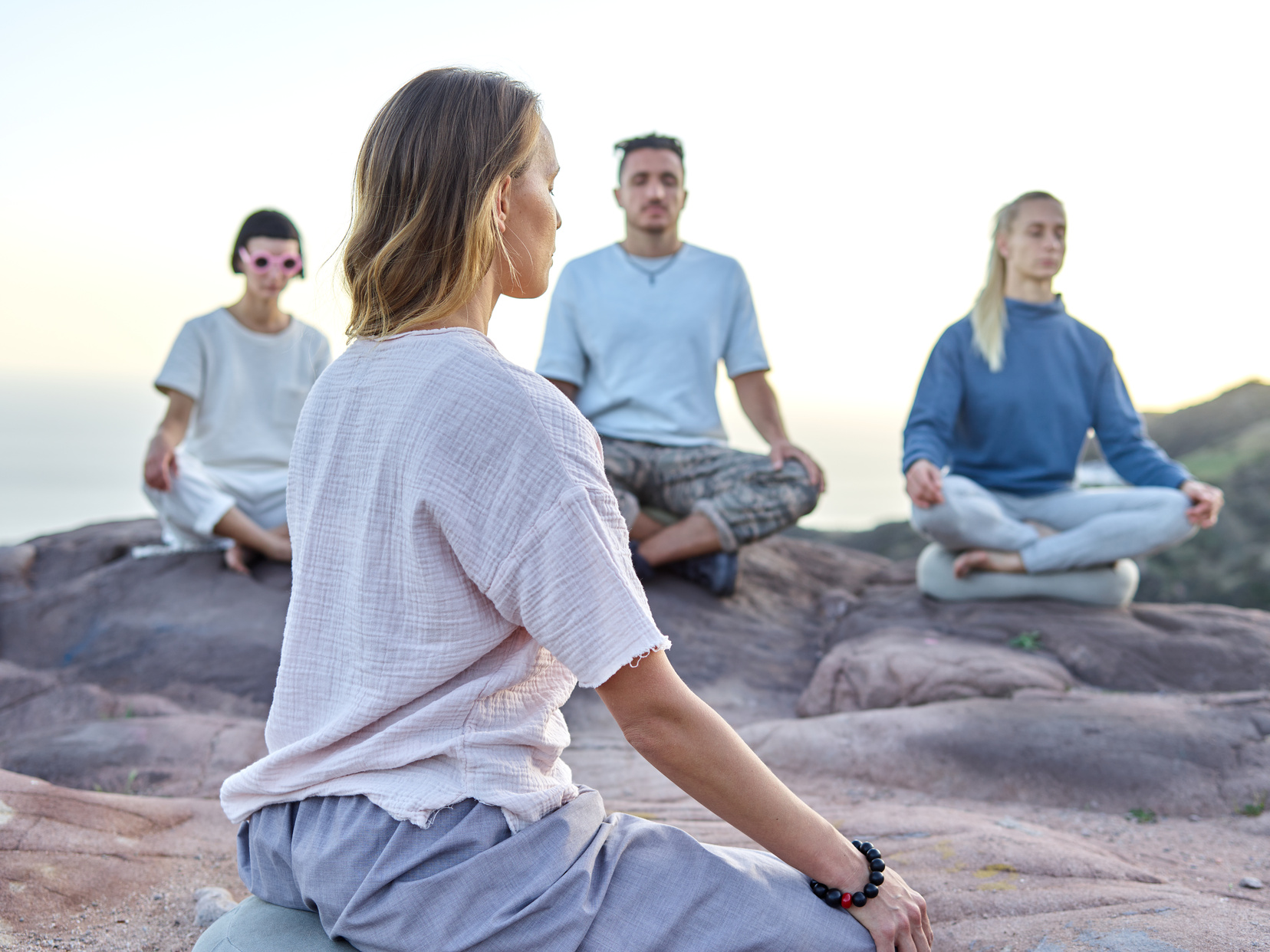 People Meditating Outdoors